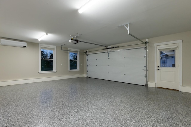 33 Little Bay Dr, Dover, NH 03820 - garage featuring a wall unit AC, a garage door opener, and baseboards