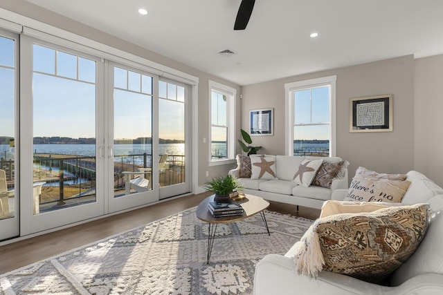 33 Little Bay Dr, Dover, NH 03820 - living area with a water view, wood finished floors, recessed lighting, and a ceiling fan