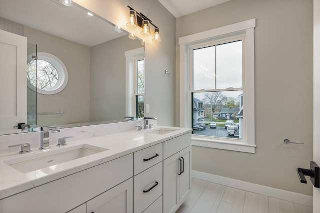 22 Little Bay Dr, Dover, NH 03820 - full bathroom with double vanity and baseboards
