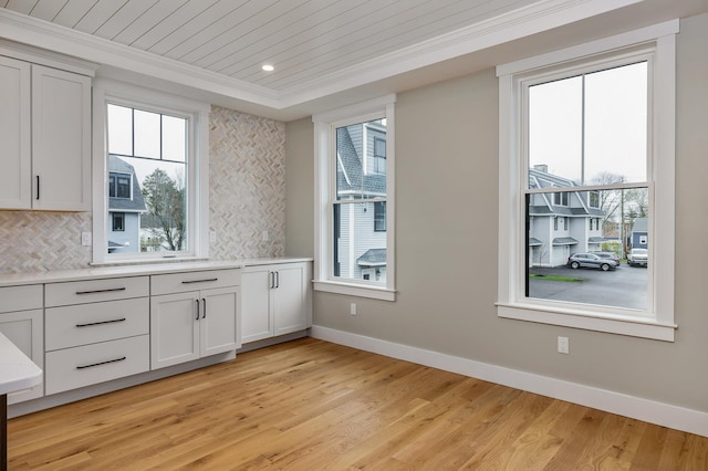 22 Little Bay Dr, Dover, NH 03820 - kitchen featuring baseboards, crown molding, light wood-style floors, decorative backsplash, and recessed lighting
