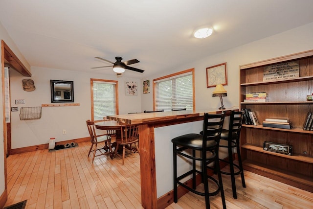 29 Isaac Frye Hwy, Wilton, NH 03086 - bar featuring light wood-style flooring, baseboards, and a ceiling fan