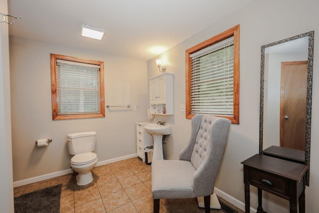 29 Isaac Frye Hwy, Wilton, NH 03086 - bathroom with baseboards, toilet, a sink, and tile patterned floors