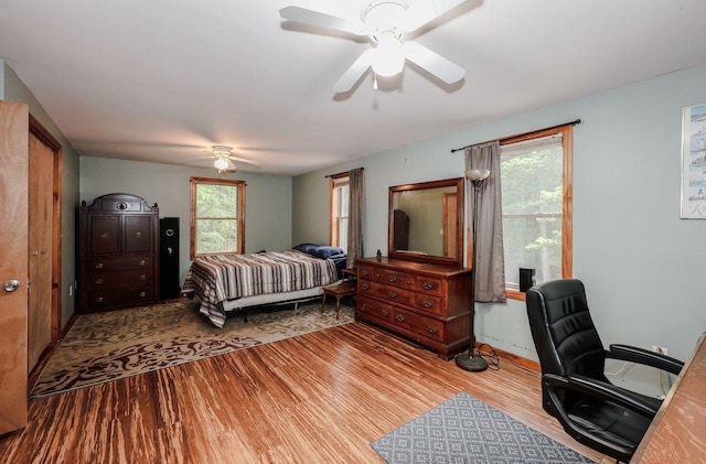 29 Isaac Frye Hwy, Wilton, NH 03086 - bedroom featuring wood finished floors, an office area, ceiling fan, and baseboards
