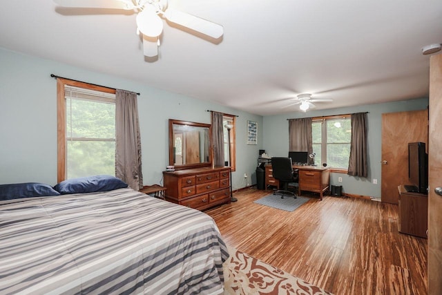 29 Isaac Frye Hwy, Wilton, NH 03086 - bedroom with wood finished floors, an office area, and a ceiling fan