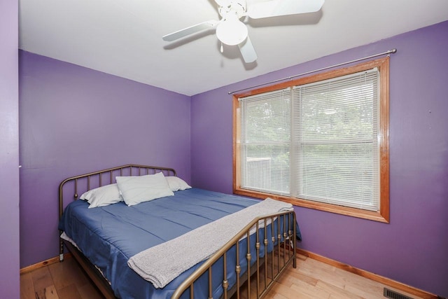 29 Isaac Frye Hwy, Wilton, NH 03086 - bedroom with baseboards, wood finished floors, and ceiling fan