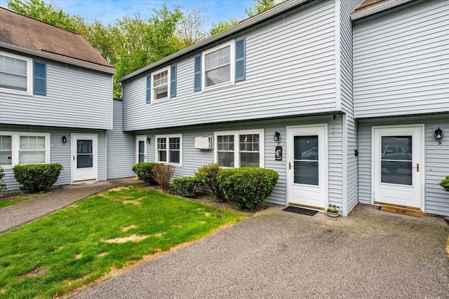 7 Daniel Plummer Rd Unit E, Goffstown, NH 03045 - view of front facade featuring a front yard
