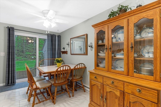 7 Daniel Plummer Rd Unit E, Goffstown, NH 03045 - dining area featuring baseboards, a ceiling fan, a baseboard radiator, and light tile patterned flooring
