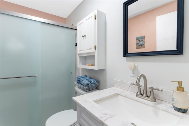 7 Daniel Plummer Rd Unit E, Goffstown, NH 03045 - bathroom featuring vanity, a stall shower, and toilet