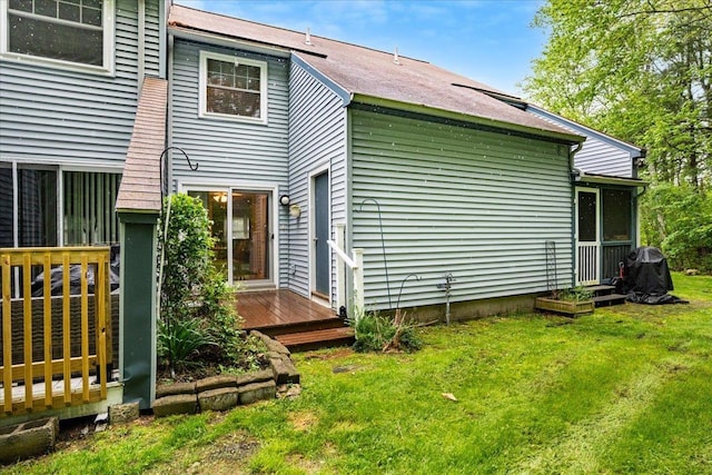 7 Daniel Plummer Rd Unit E, Goffstown, NH 03045 - rear view of house featuring a wooden deck and a lawn