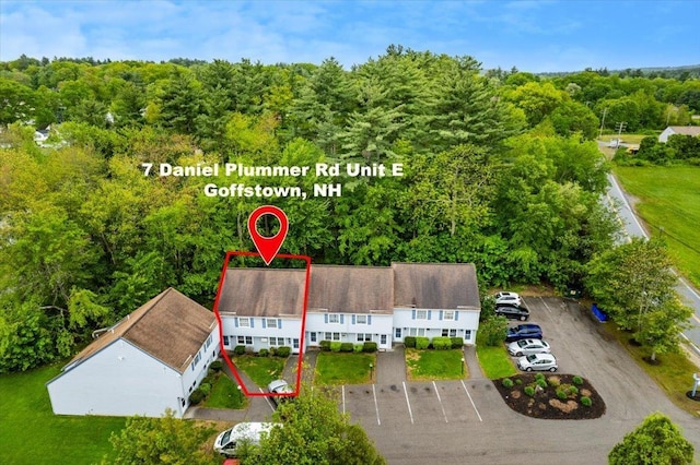7 Daniel Plummer Rd Unit E, Goffstown, NH 03045 - aerial view of property and surrounding area with a heavily wooded area and property boundaries highlighted