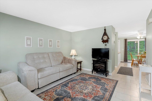7 Daniel Plummer Rd Unit E, Goffstown, NH 03045 - living area with baseboards, a ceiling fan, and light tile patterned flooring