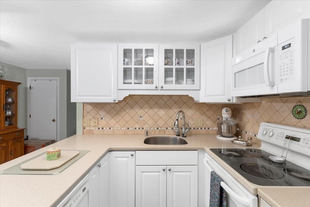 7 Daniel Plummer Rd Unit E, Goffstown, NH 03045 - kitchen featuring white appliances, a sink, light countertops, white cabinets, and a textured ceiling