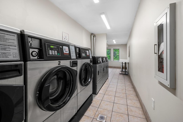 58 Branch Tpke Unit 69Aka A22, Concord, NH 03301 - communal laundry room featuring separate washer and dryer, light tile patterned floors, and baseboards