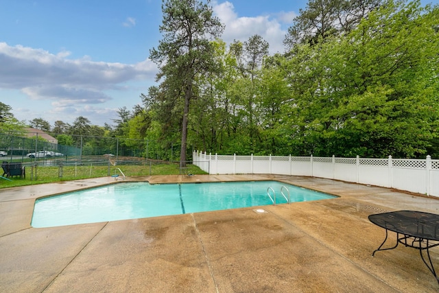 58 Branch Tpke Unit 69Aka A22, Concord, NH 03301 - view of swimming pool with a patio and view of wooded area