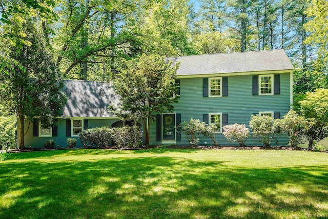 16 Pulpit Run, Amherst, NH 03031 - colonial house featuring a front lawn and roof with shingles