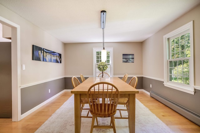 16 Pulpit Run, Amherst, NH 03031 - dining room with a baseboard radiator, light wood-style floors, and baseboards