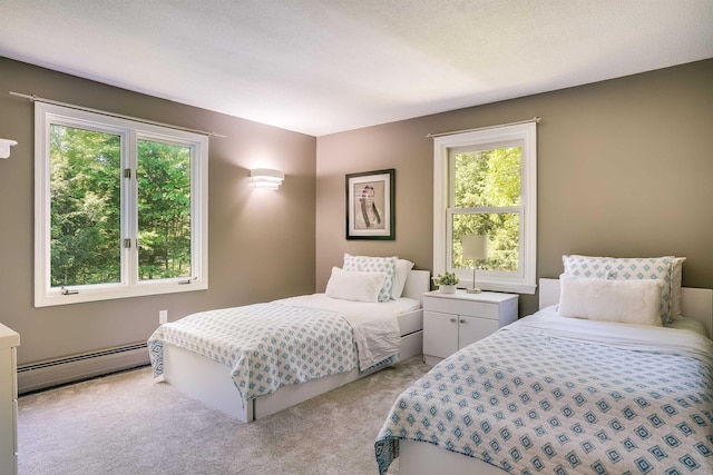 16 Pulpit Run, Amherst, NH 03031 - bedroom with a baseboard radiator, multiple windows, and light colored carpet