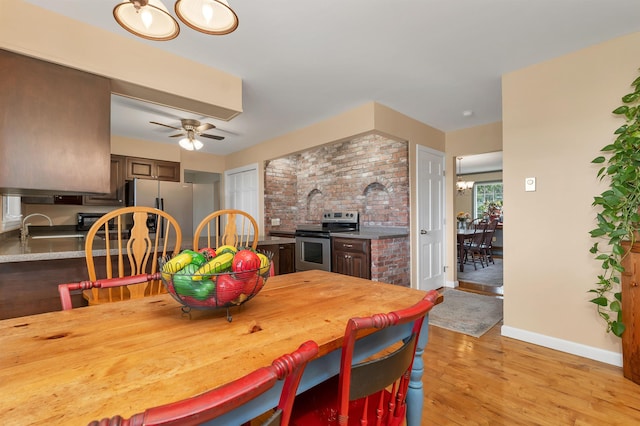 223 Deering Center Rd, Deering, NH 03244 - dining space with light wood-style floors, baseboards, and a ceiling fan