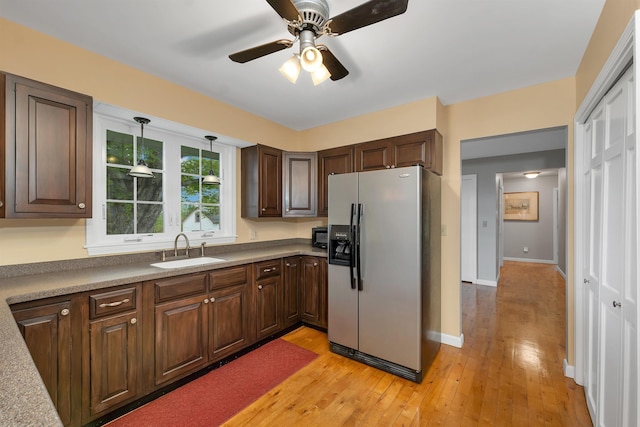 223 Deering Center Rd, Deering, NH 03244 - kitchen featuring refrigerator with ice dispenser, a sink, light wood finished floors, ceiling fan, and dark brown cabinets