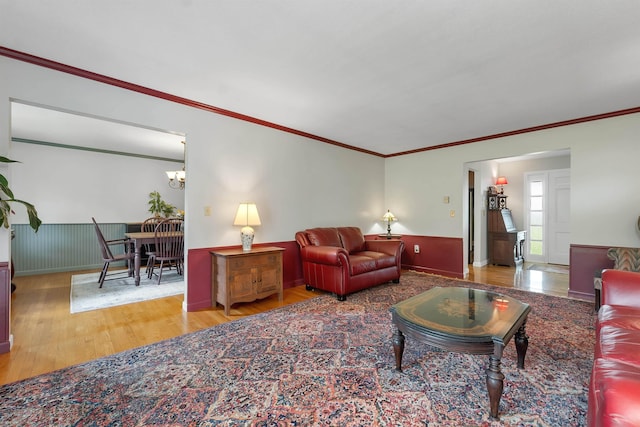 223 Deering Center Rd, Deering, NH 03244 - living area with wood finished floors, a chandelier, and crown molding