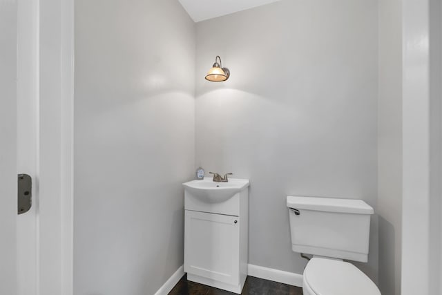 223 Deering Center Rd, Deering, NH 03244 - bathroom with toilet, vanity, and baseboards