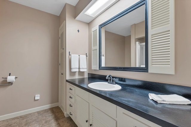 223 Deering Center Rd, Deering, NH 03244 - bathroom featuring vanity, baseboards, and a closet