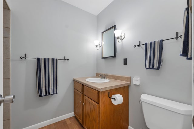 223 Deering Center Rd, Deering, NH 03244 - bathroom featuring vanity, toilet, wood finished floors, and baseboards