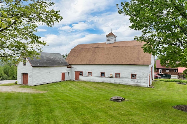 223 Deering Center Rd, Deering, NH 03244 - rear view of property with a barn, a yard, an outbuilding, a shingled roof, and a garage