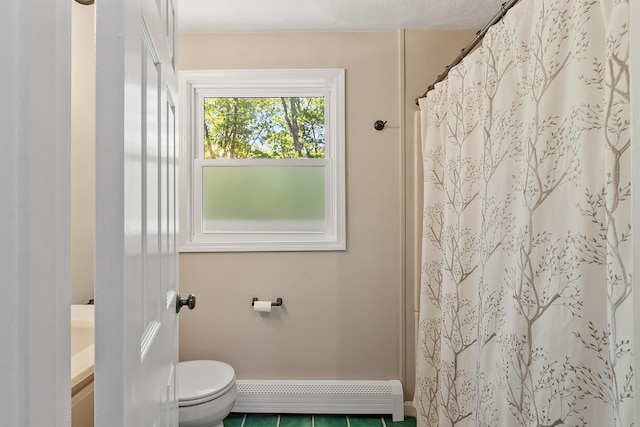 11 Woodhenge Cir, Londonderry, NH 03053 - full bathroom with a baseboard heating unit, toilet, vanity, tile patterned floors, and a shower with shower curtain