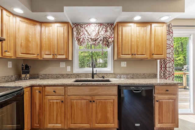11 Woodhenge Cir, Londonderry, NH 03053 - kitchen featuring black appliances, a sink, light stone counters, and recessed lighting