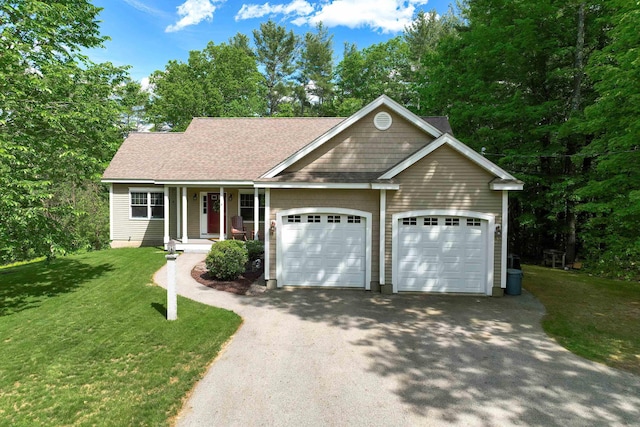 5 Springvale Ave, Brookline, NH 03033 - view of front facade with asphalt driveway, an attached garage, a shingled roof, and a front lawn