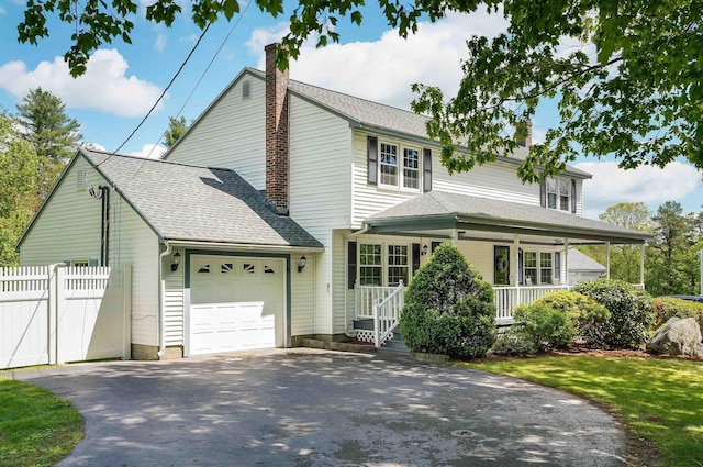 86 Pelham Rd, Salem, NH 03079 - traditional-style house featuring driveway, a porch, an attached garage, a chimney, and roof with shingles