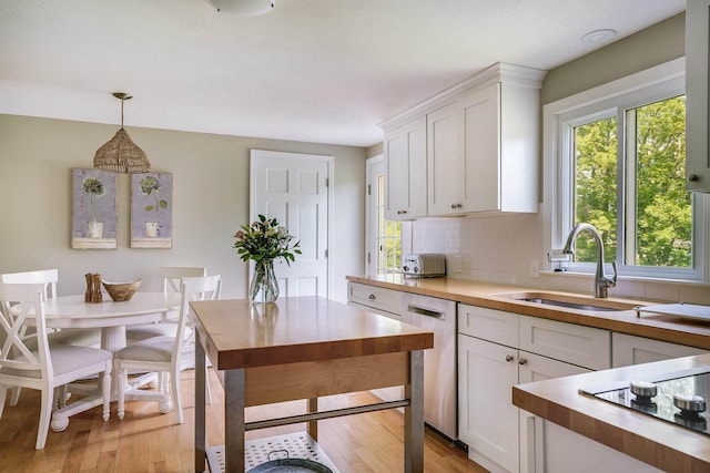 86 Pelham Rd, Salem, NH 03079 - kitchen with stainless steel dishwasher, a sink, and butcher block countertops
