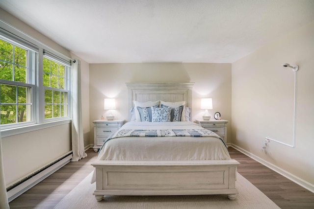 86 Pelham Rd, Salem, NH 03079 - bedroom featuring a baseboard heating unit, wood finished floors, and baseboards