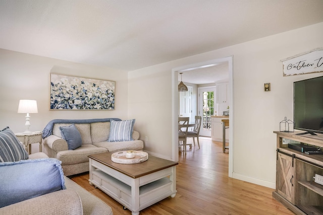 86 Pelham Rd, Salem, NH 03079 - living room with light wood-style flooring and baseboards