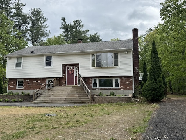 9 Quarry Rd, Hampstead, NH 03841 - raised ranch with a chimney and brick siding