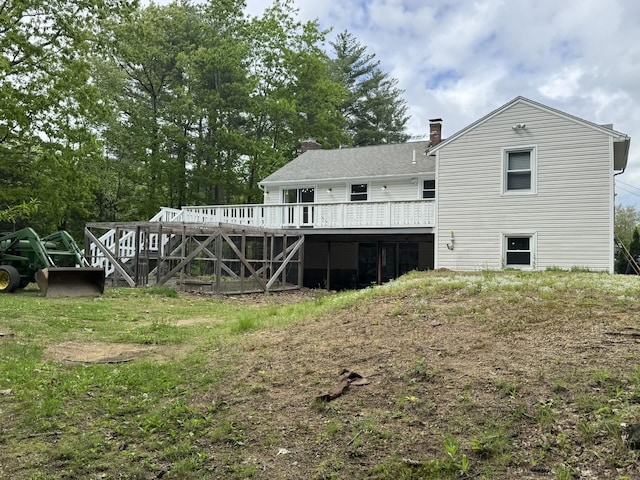 9 Quarry Rd, Hampstead, NH 03841 - back of property with a deck and a chimney