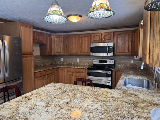 9 Quarry Rd, Hampstead, NH 03841 - kitchen featuring appliances with stainless steel finishes, a sink, light stone countertops, backsplash, and hanging light fixtures