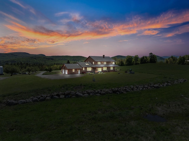 338 Johnson Rd, Marshfield, VT 05658 - back of property with a yard, driveway, and a garage