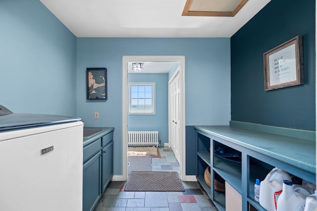 338 Johnson Rd, Marshfield, VT 05658 - washroom featuring radiator heating unit, cabinet space, washer / dryer, stone finish flooring, and baseboards