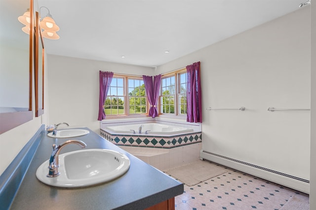 338 Johnson Rd, Marshfield, VT 05658 - full bath with baseboard heating, double vanity, and a garden tub