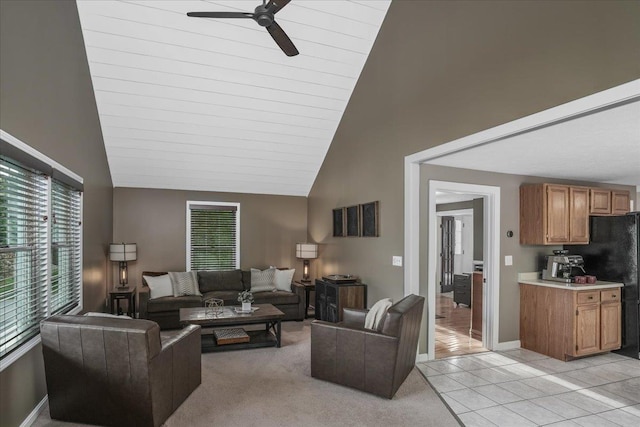 37 Level St, Merrimack, NH 03054 - living room featuring a ceiling fan, high vaulted ceiling, baseboards, and light tile patterned floors