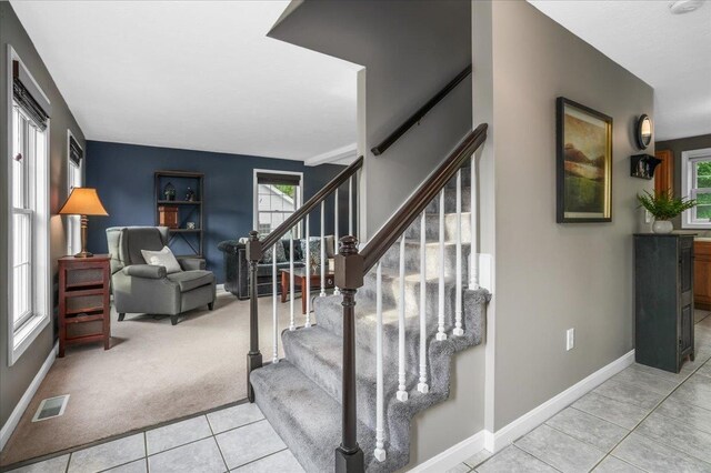 37 Level St, Merrimack, NH 03054 - stairway featuring tile patterned floors, baseboards, and carpet flooring