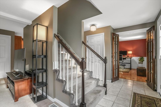 37 Level St, Merrimack, NH 03054 - stairs with tile patterned flooring and baseboards