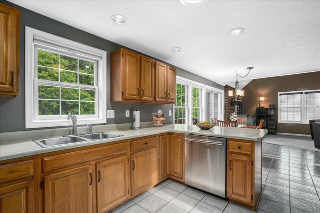 37 Level St, Merrimack, NH 03054 - kitchen featuring dishwasher, a sink, a peninsula, light countertops, and vaulted ceiling