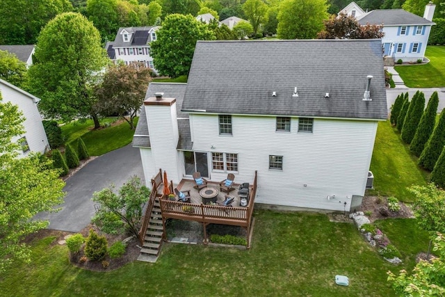 37 Level St, Merrimack, NH 03054 - rear view of house featuring a wooden deck, a yard, a chimney, and stairway
