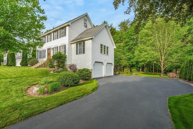 37 Level St, Merrimack, NH 03054 - view of front of property featuring asphalt driveway, an attached garage, and a front lawn