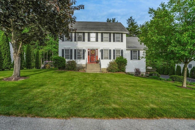 37 Level St, Merrimack, NH 03054 - colonial-style house featuring a front yard and a shingled roof