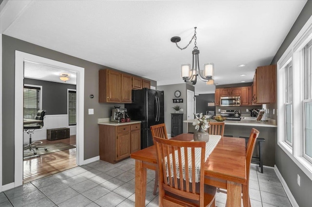 37 Level St, Merrimack, NH 03054 - dining area featuring light tile patterned floors, a chandelier, baseboards, and recessed lighting