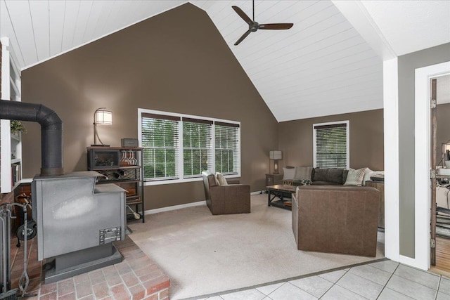 37 Level St, Merrimack, NH 03054 - living room featuring a wood stove, a ceiling fan, baseboards, and high vaulted ceiling